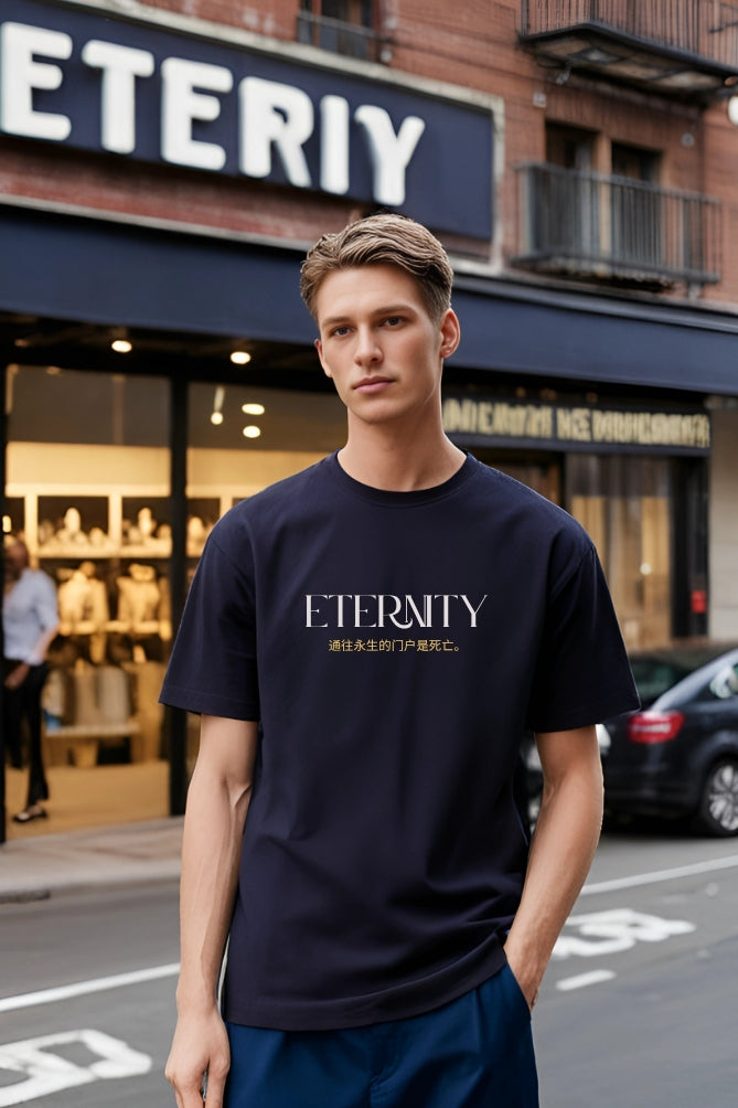 Man wearing an 'Eternity' t-shirt in front of a store with the same name.
