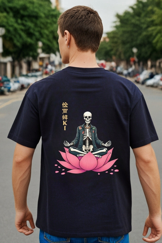 Man wearing a black t-shirt with a skeleton on a pink lotus design and Japanese text on the back.